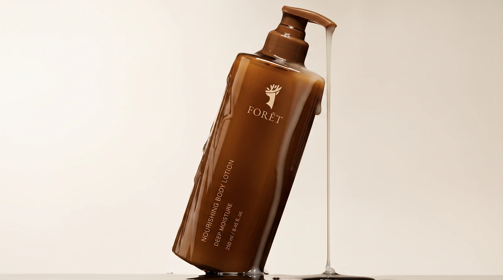 Foret body lotion mid pour, deer mark on the amber bottle