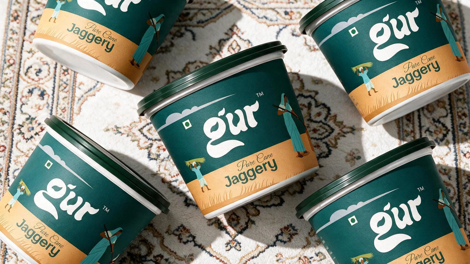GUR tubs spread across a traditional patterned carpet