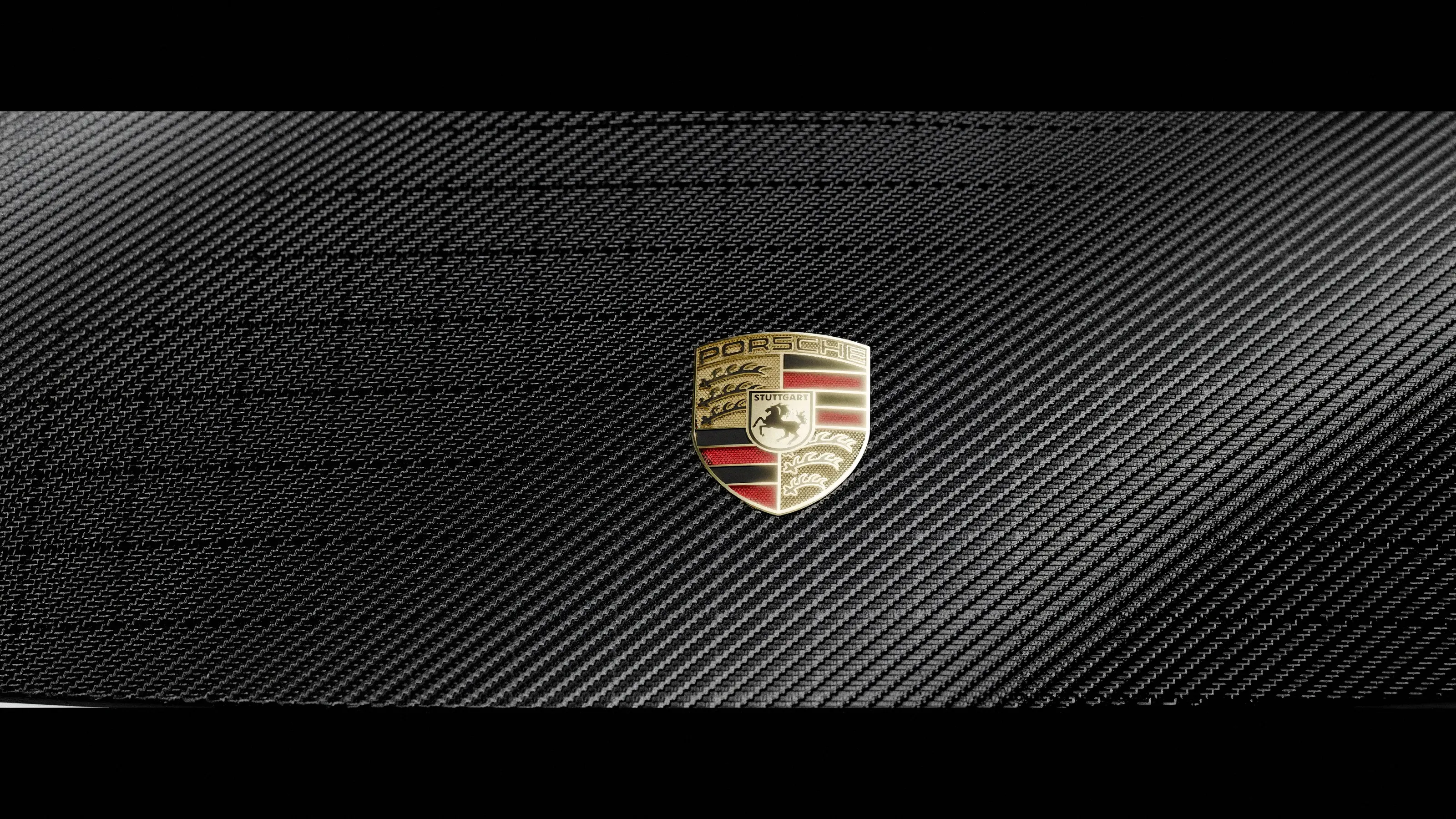 Porsche crest on woven carbon fibre