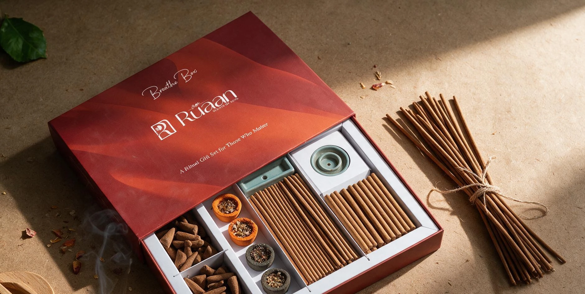 Breathe Box open on kraft paper: incense sticks, cones and burner tray
