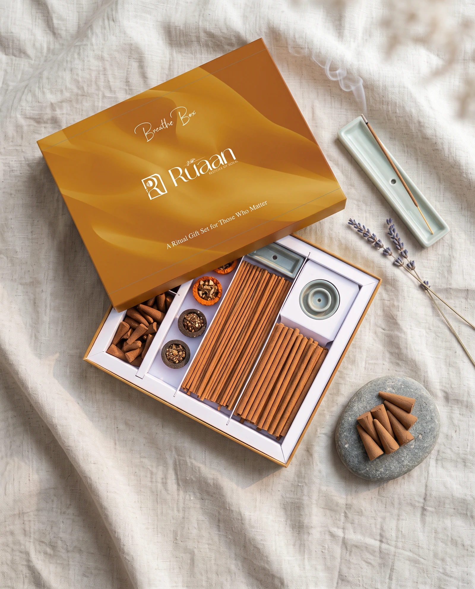 Amber Breathe Box open on linen with lavender sprigs